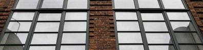 Gray Brick Building With Glass Windows - Free LinkedIn Background Photo