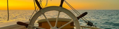 Yacht Sailing In The Middle Of The Sea During Sunset - Free LinkedIn Background Photo