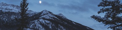twilight moonrise over snowy mountain - Free LinkedIn Background Photo