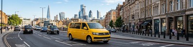 yellow van on city road - Free LinkedIn Background Photo